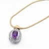 18K COLGANTE ORO BICOLOR OVAL CON CIRCONITAS Y PIEDRA AMATISTA.