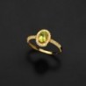 18K SORTIJA ORO AMARILLO CON OLIVINA Y CIRCONITAS. OLIVINA: 6X4 MM 0,47 KTES.